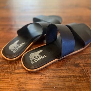 Black Sorel slip-on sandals